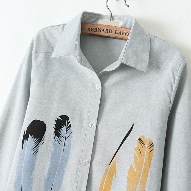 blouse with feather print