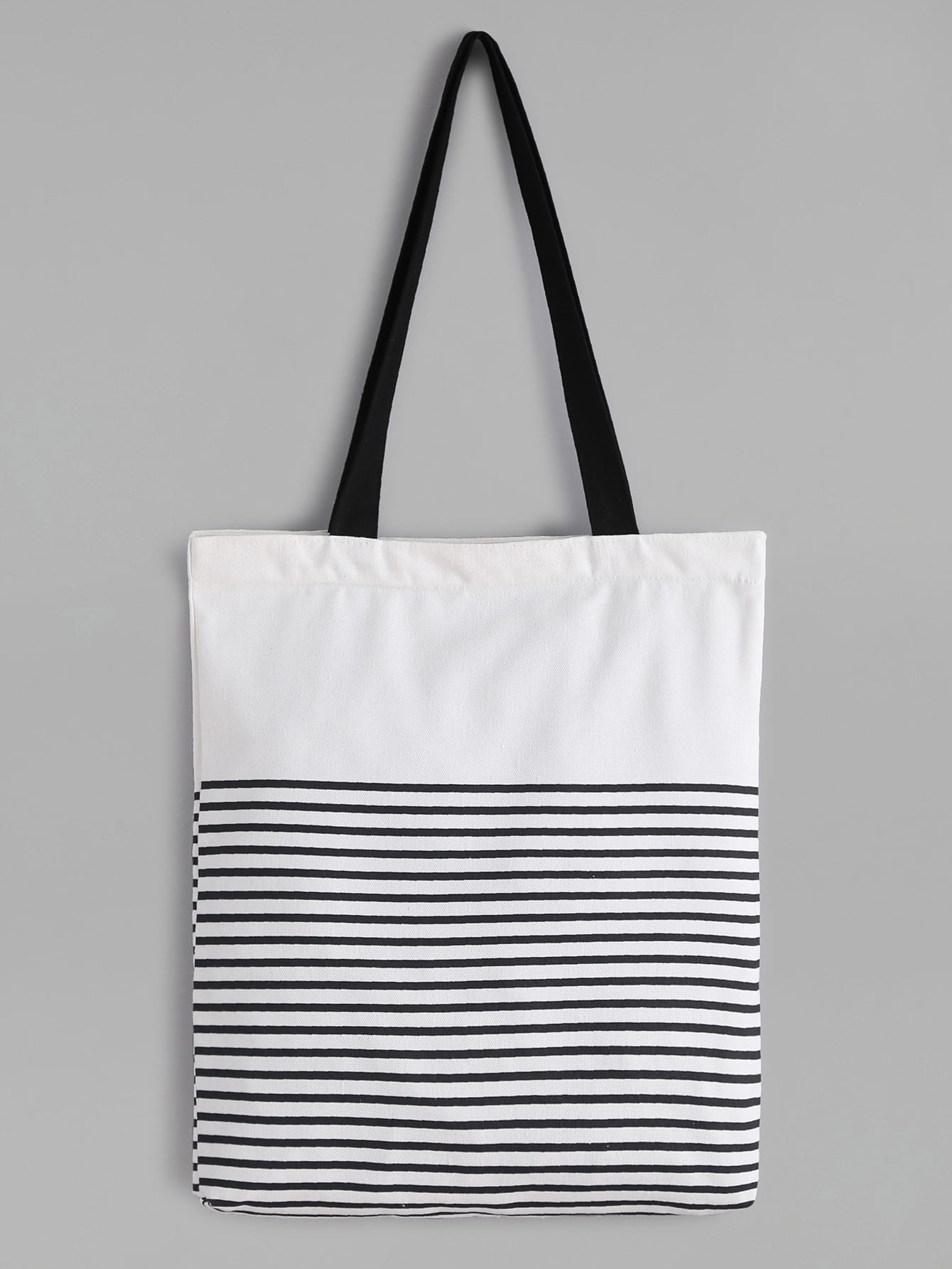 white striped canvas tote bag with black strap