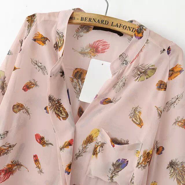 blouse with feather print
